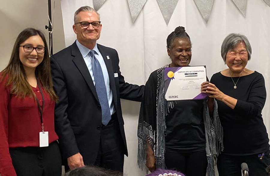 Photo of Joyce Hayashi during a caregiver training graduation event.