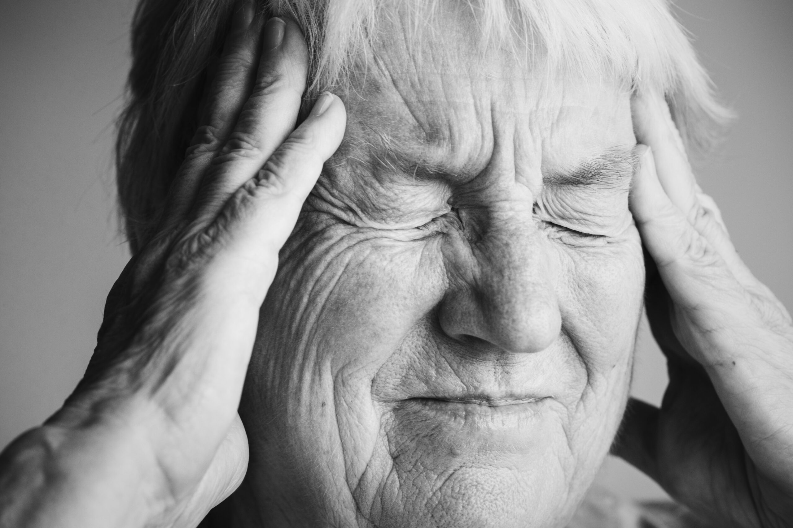 Older adult woman suffers from memory loss, Alzheimer's, dementia