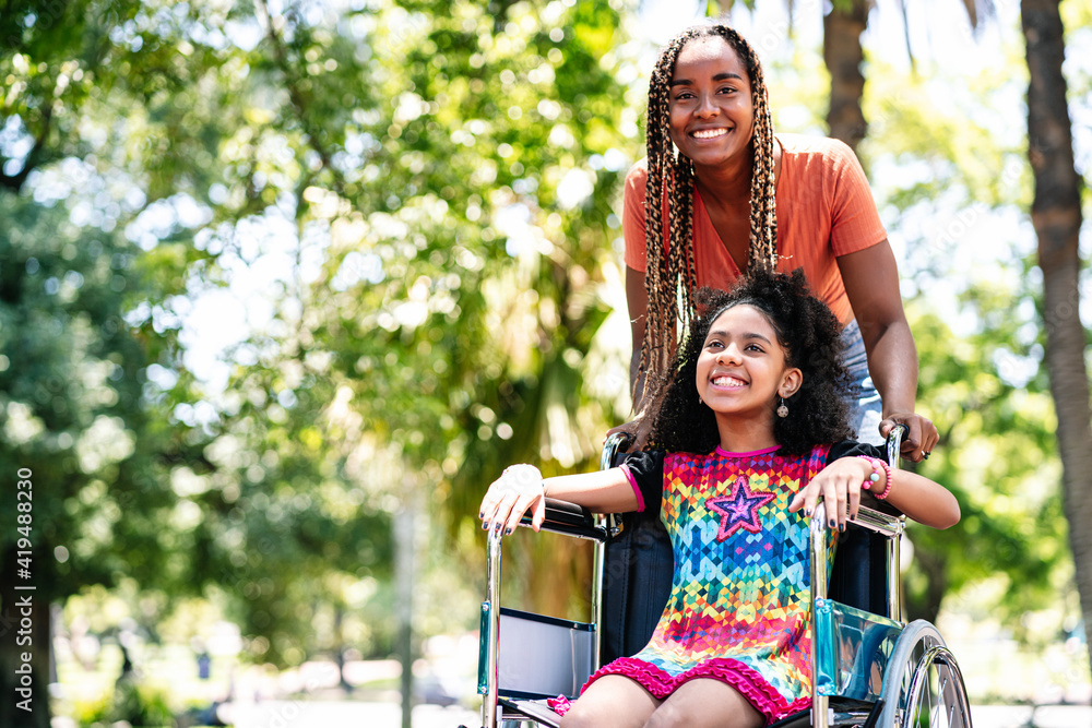 IHSS caregiver pushes young care recipient in wheelchair