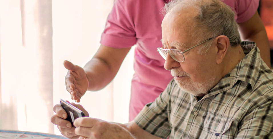 Caregiver helps consumer with Digital Technology
